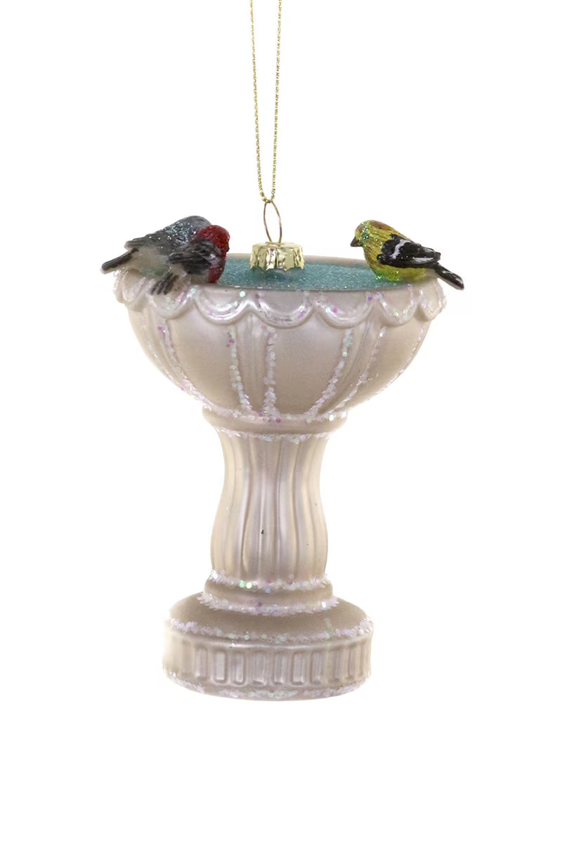 Decorative bird bath ornament with birds on a white background