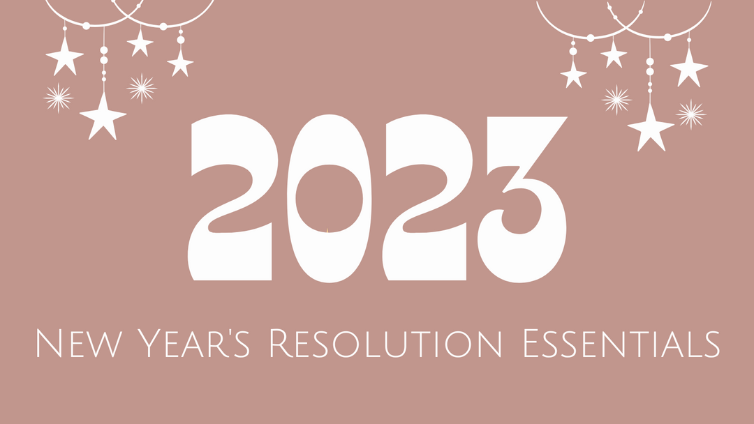 2023 New Year's Resolution Essentials. A light pink background with white star ornaments hanging from the top of the page. 