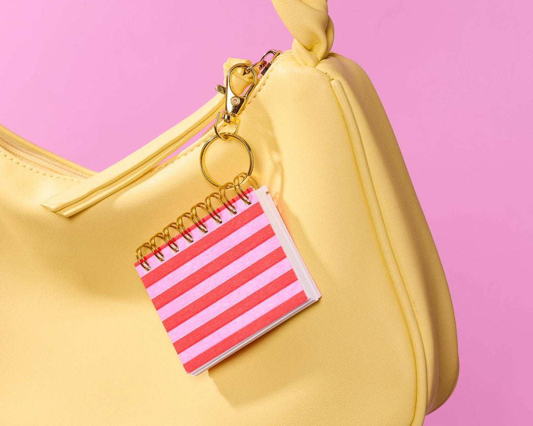 And Here We Are paper Letterpress Mini Notebook Bag Charm—Red Pink Cabana Stripe