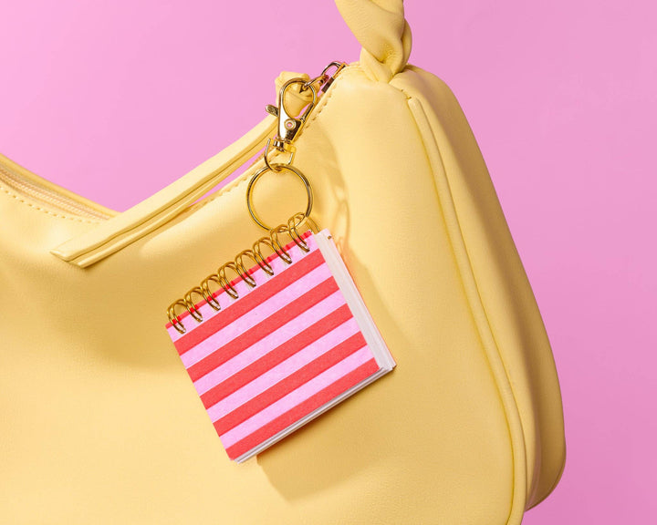 And Here We Are paper Letterpress Mini Notebook Bag Charm—Red Pink Cabana Stripe