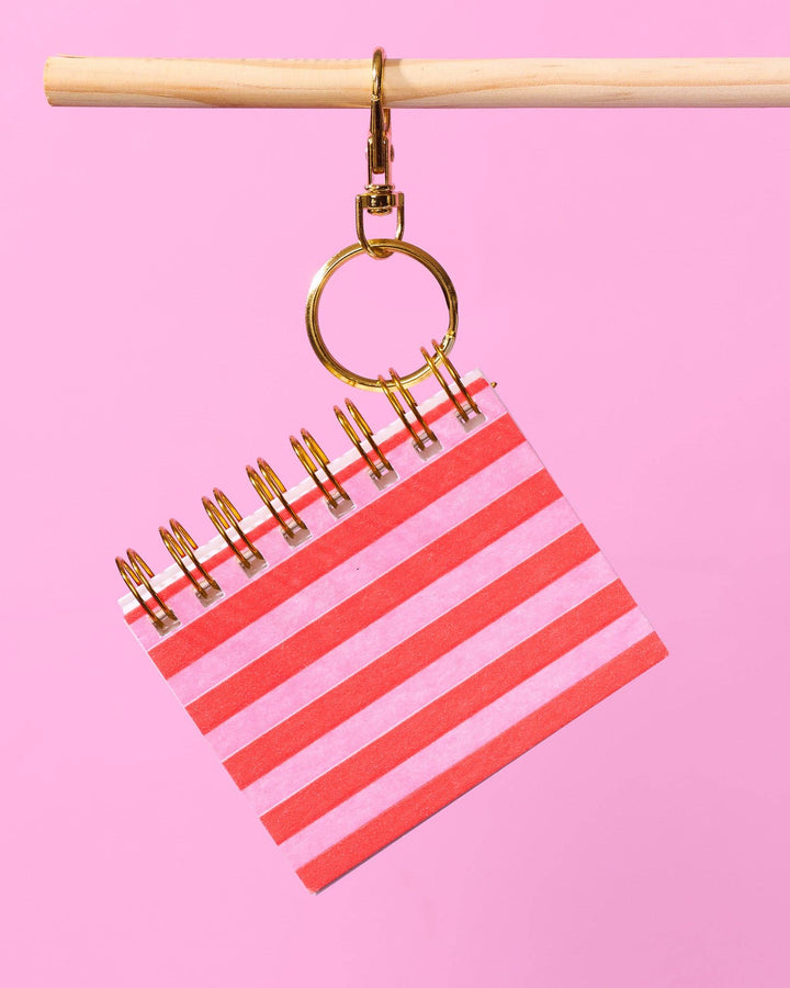 And Here We Are paper Letterpress Mini Notebook Bag Charm—Red Pink Cabana Stripe