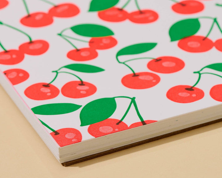 And Here We Are paper Letterpress Unlined Spiral Notebook—Cherries