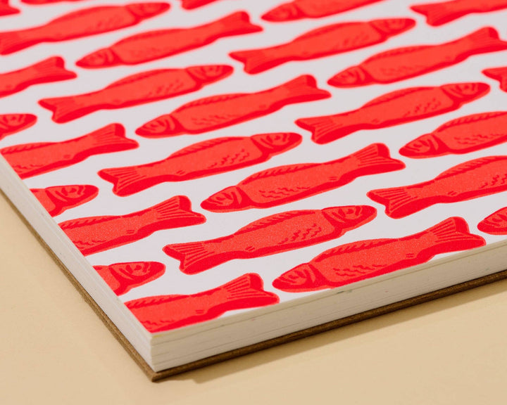 And Here We Are paper Letterpress Unlined Spiral Notebook—Red Gummy Fish