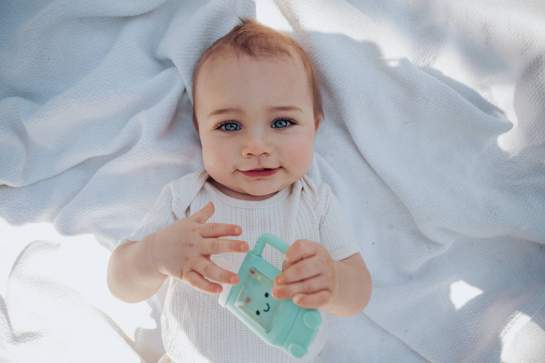 Itzy Ritzy Sweetie Shake Plus™ - Teething + Rattle Toy: Sushi