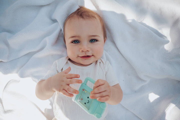 Itzy Ritzy Sweetie Shake Plus™ - Teething + Rattle Toy: Sushi