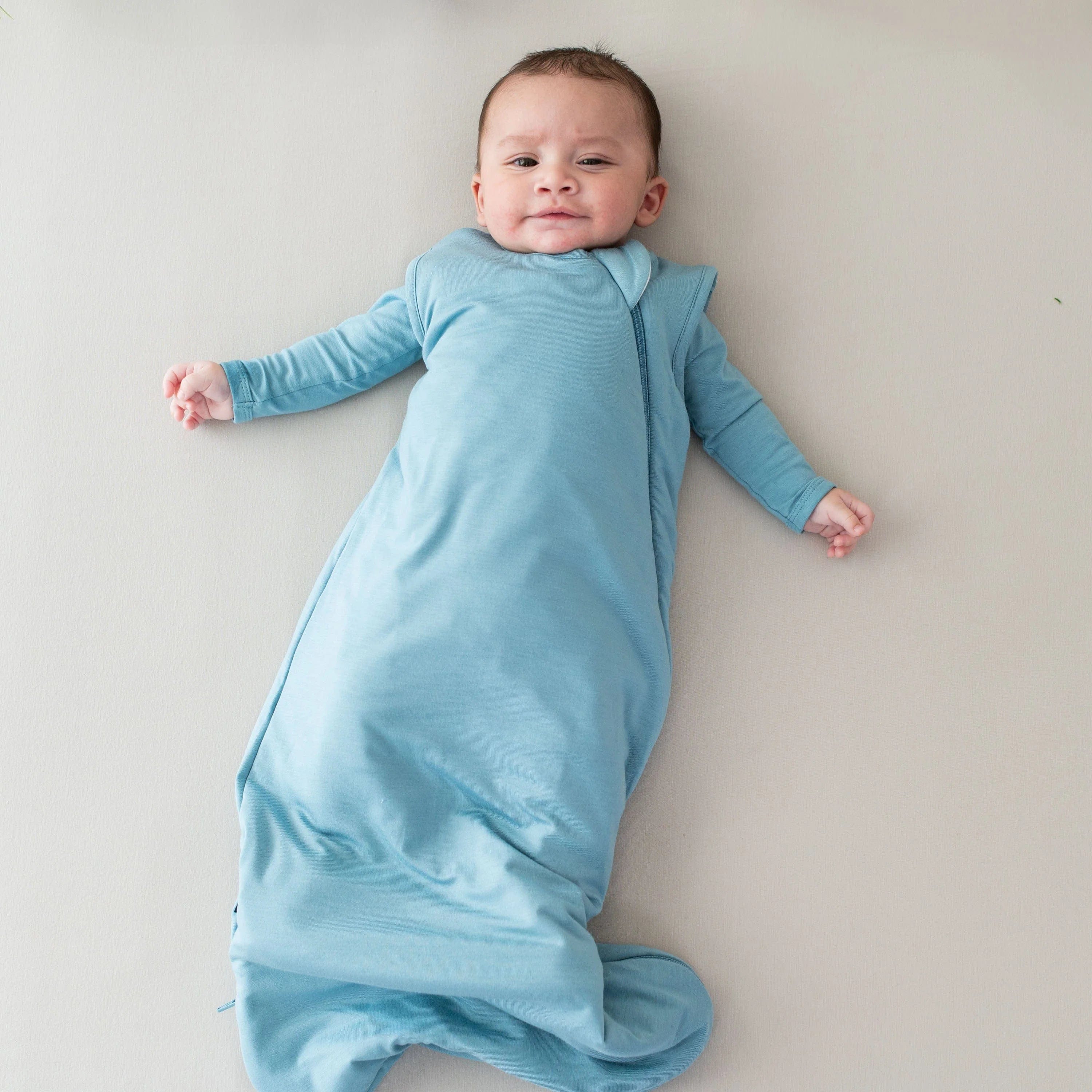 kyte-baby-sleeping-sleep-bag-in-dusty-blue-40027819868356.webp?v\u003d1726570698\u0026width\u003d1000