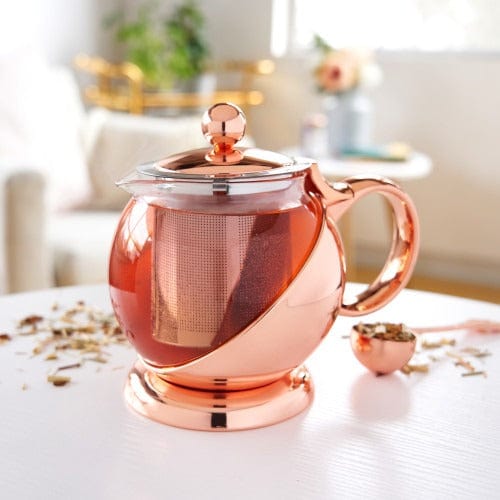 https://paper-luxe.com/cdn/shop/files/pinky-up-tea-infusions-shelby-glass-rose-gold-wrapped-teapot-35178662330564.jpg?v=1699910169&width=720